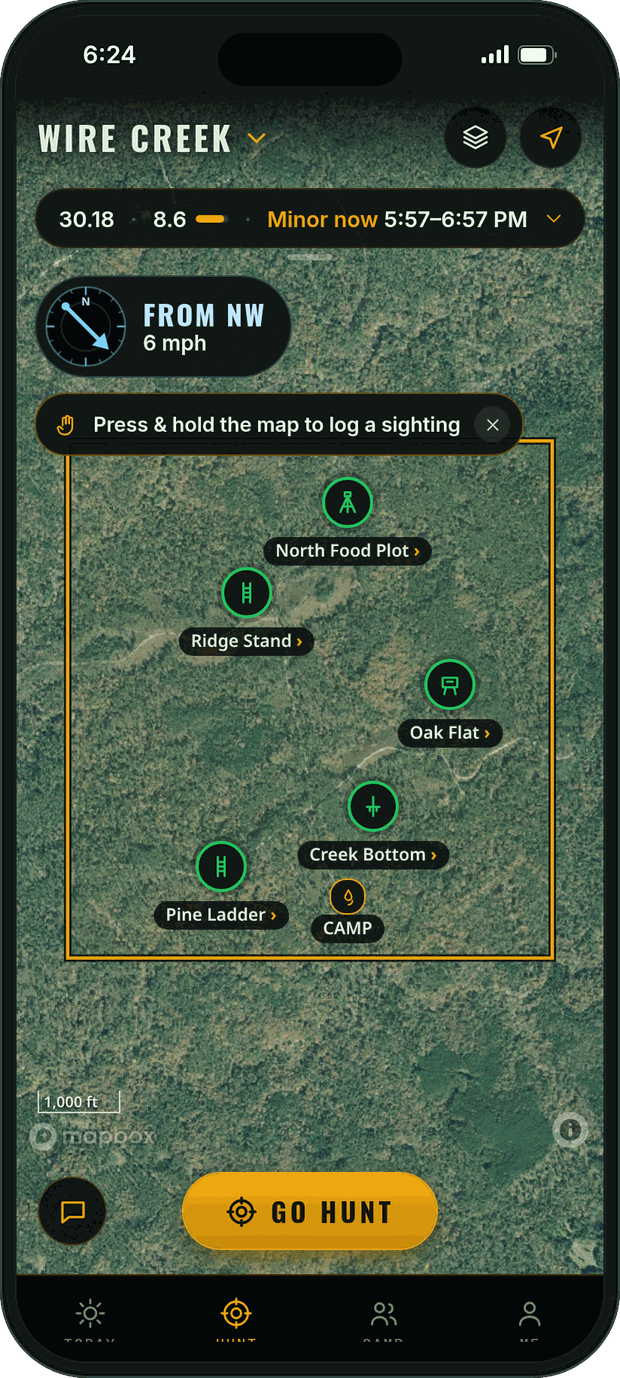 Hunt map in Tap & swipe: the property line and stands on a satellite map, the wind gauge, a one-time tip to press and hold the map to log a sighting, and the Go hunt button