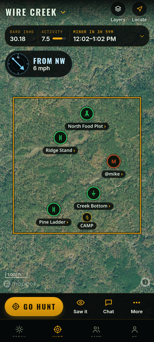 Hunt map on satellite: the Wire Creek property line with five stands over woods, wind from the northwest at 6 mph, a strip with pressure, activity and the minor period, and Go hunt, Saw it, Chat and More buttons