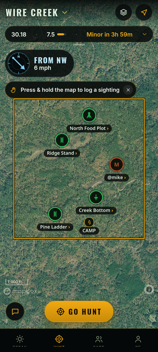 Hunt map in Tap & swipe: the property line and stands on a satellite map, the wind gauge, a one-time tip to press and hold the map to log a sighting, and the Go hunt button
